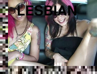 Luscious lesbians masturbating in a back seat of a car