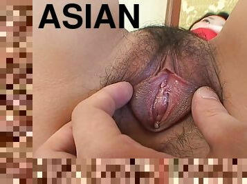 Wet Asian cunt exposed in a close up view