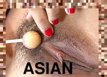 Kianna Bonn rubs her Asian cunt with a lollipop and enjoys ardent sex
