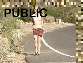 Lola strips naked and walks down a public street wearing only a smile
