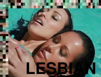 Radiant lesbian brunettes enjoying a candid pussy toying session in the pool