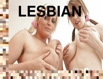 Seductive lesbian cowgirls enjoy fondling their big tits