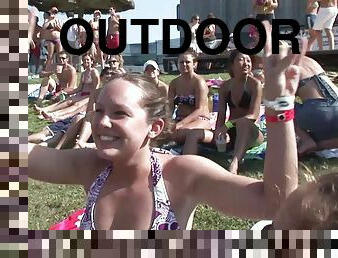 Outdoor reality clip with chicks wearing bikinis having fun at a party