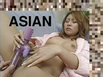 Magnificent Asian solo model pleasing her hairy pussy with toys