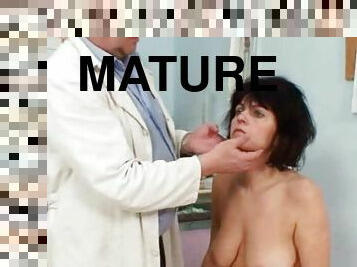 Mature brunette gets her pussy examined by a lewd doctor