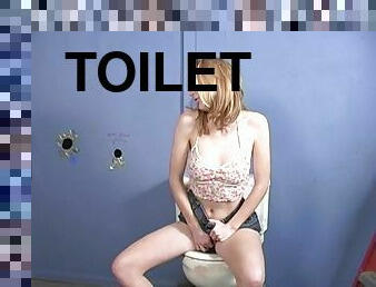 Kelly Wells sucks a gloryhole dick and gtes ass fucked in toilet