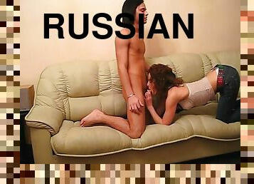 A curly Russian chick gets nailed on a sofa by her skinny boyfriend