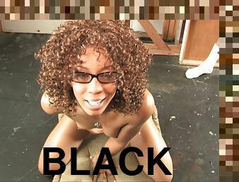 A curly Black girl in glasses sucks and strokes white dicks