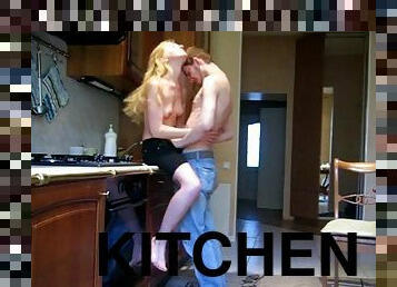A slim blonde gives head and rides a dick in a kitchen