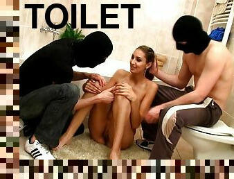 Two dudes in masks fuck slim teen in a bathrooom