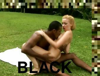 Blonde bitch gets fucked by a hung black guy outdoors