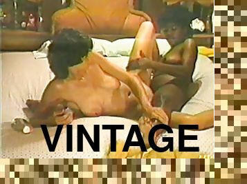 Two short-haired bitches make love in vintage interracial scene