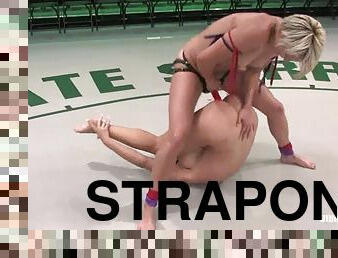 Blond wrestler is fucking her opponent with a huge strapon