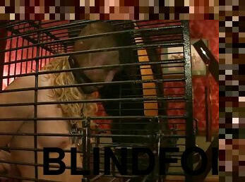 Horny blonde chick in cage gets tied up and blindfolded