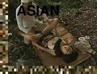 Asian bitch gets a chance to suck and ride a cock in a forest