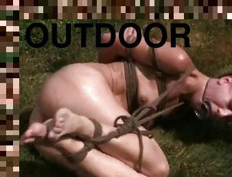 BDSM Slave Elise Graves gets punished outdoors