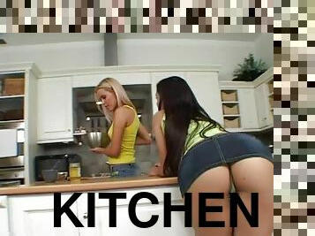 Eve Angel and Sophie Moone enjoy licking each other's vags in the kitchen