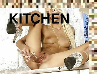 Hot blonde girl makes herself cum in the kitchen