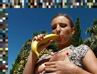 Passionate girl shoves a banana in her tight pussy