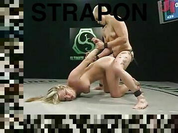Expert Blonde Wrestler Dominates a Newbie and Fucks Her with Strapon