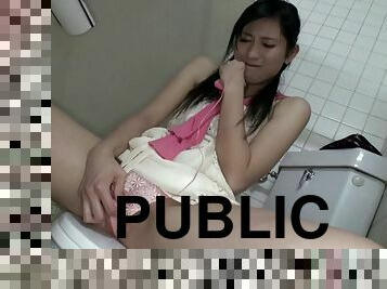 In a public restroom she sucks a total stranger's cock