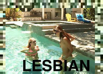 Lesbian babes kissing in the pool end up eating out each other