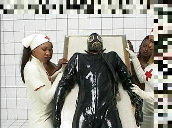 Black nurses in white latex fuck a white guy in a gas mask