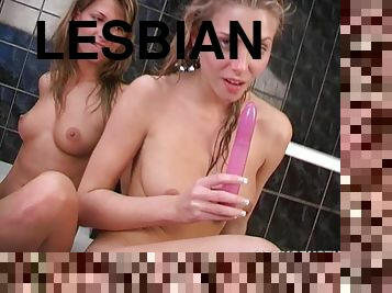 Lesbian babes enjoys naked game together in bath tub