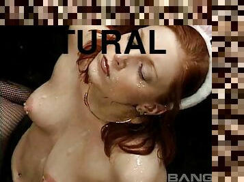 Seductive redhead gets her face covered in jizz at a raunchy bukkake party