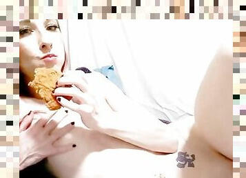 Eating a piece of chicken naked