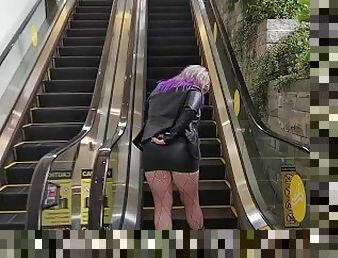 Milf in mini skirt rubs pussy on public escalator tor