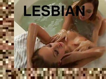 Sensual lesbian kissing ladies in the bathtub