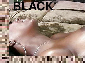 Black slut with an oiled up booty rides a hard black tool