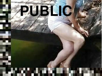 Public outdoors crossed legs orgasm near a river with boats passing by