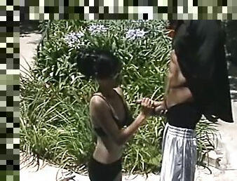 Skinny Asian girl in glasses gives a handjob outdoors