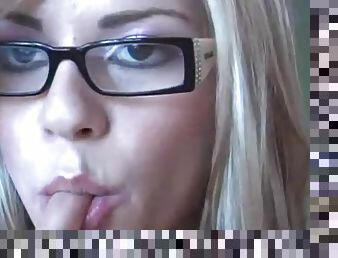 Webcam beauty in glasses masturbates her vagina