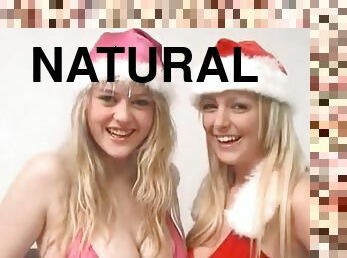 Two blondes wearing Santa hats show their big natural tits