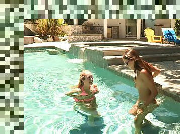 Lesbian babes kissing in the pool end up eating out each other