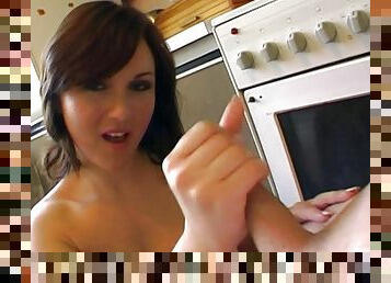 Pretty cowgirl gives out a breath-taking handjob in the kitchen