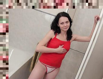 Dreamy teenage brunette washes her amazing body in the shower