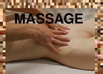 Oil massage for a young beauty. Erotic massage
