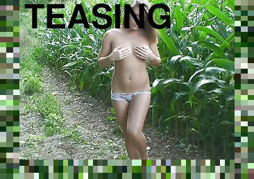 Stripping girl in the fields