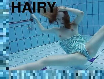 Super slender girl showing off her beauty underwater