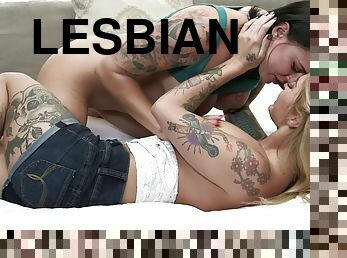 Tattooed lesbian moans while getting her pussy jammed with toys