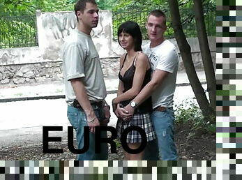 East European girl takes two, outside