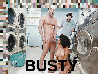 Busty ebony Ariana Aimes takes white cock from behind in laundromat