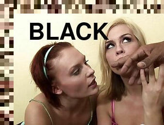 Two cuties share a black meat pole