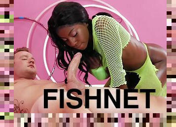 A chocolate girl in green fishnets takes a white dick from behind