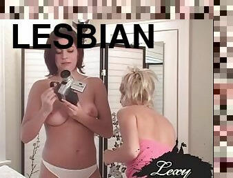 Lexi Lohan and lesbian babe show off big boobs and lick them