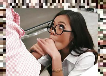 A cute asian teen in glasses sucks a big cock to get it ready for her slit
